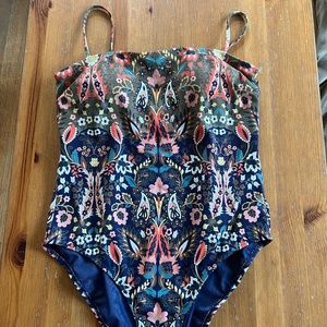 Boden floral paisley swimsuit with Navy blue background.